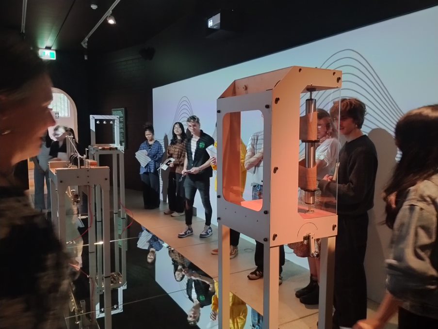 Students _standing inside an exhibit