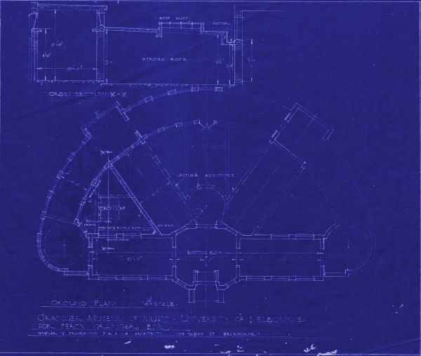 Architectural floor plan of museum building, with white markings on purple background