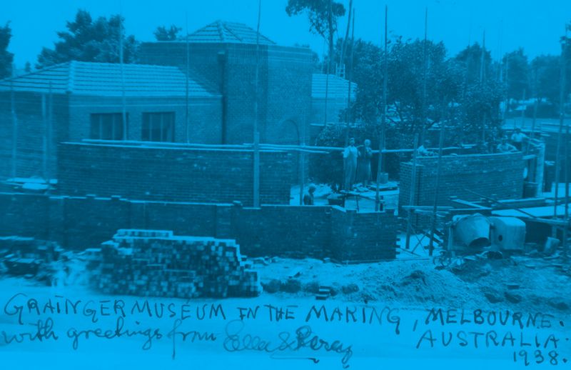 Photograph of man and woman standing outside building underconstruction, with blue overlay and descriptive text, 